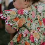 Faith floral scallop short sleeve romper back view showing scalloped hem and floral print detail
