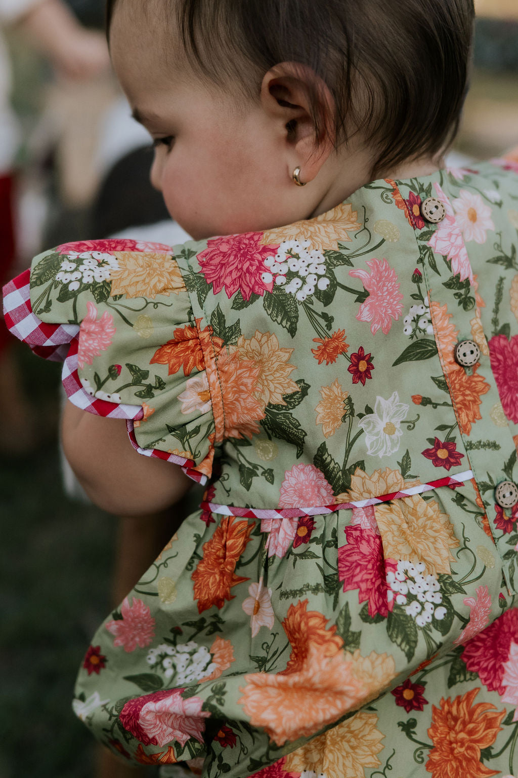 Faith floral scallop short sleeve romper back view showing scalloped hem and floral print detail