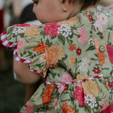Faith floral scallop short sleeve romper back view showing scalloped hem and floral print detail