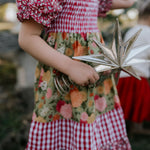 Penelope block twirl dress worn by girl showing beautiful twirl skirt movement and colour block design