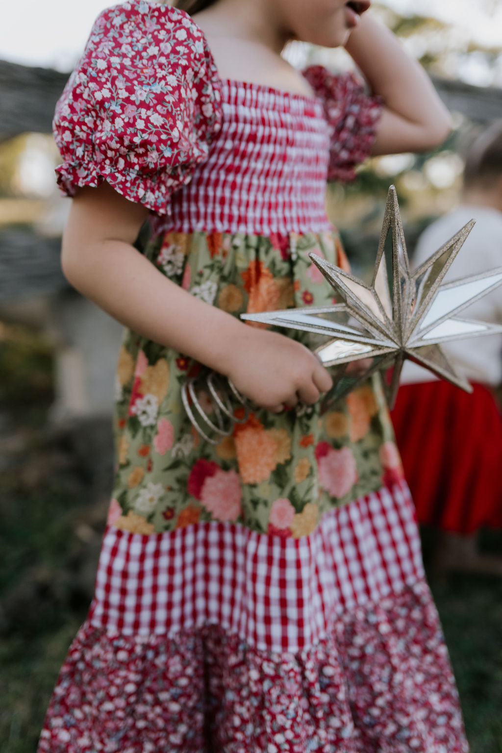 Penelope block twirl dress worn by girl showing beautiful twirl skirt movement and colour block design