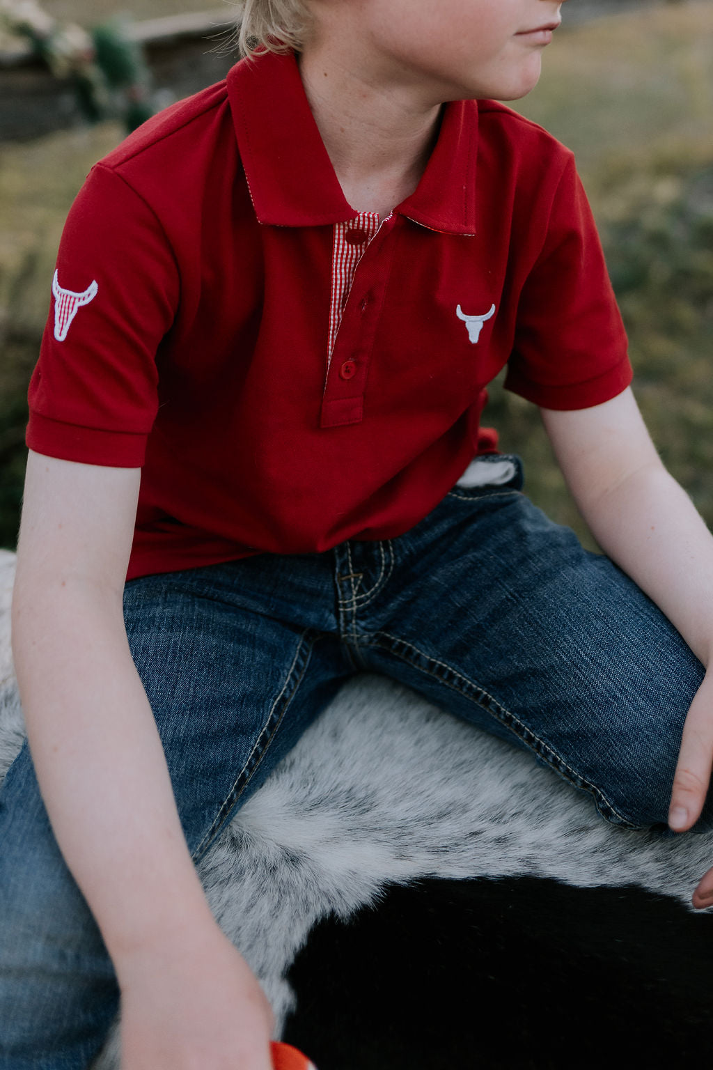 Nick deep red boys polo shirt flatlay showing full polo design in deep red