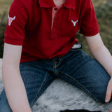 Nick deep red boys polo shirt flatlay showing full polo design in deep red