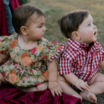 Barnley deep red checked short sleeve romper fabric close-up showing quality deep red gingham check