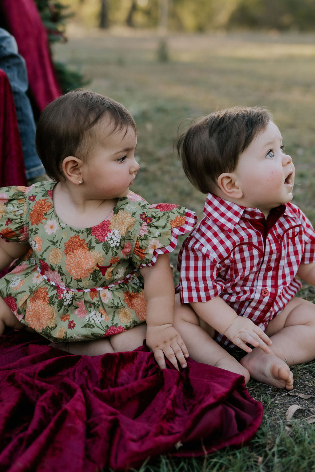 Barnley deep red checked short sleeve romper fabric close-up showing quality deep red gingham check