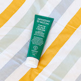 MooGoo Baby Scalp Cream tube on white background showing natural and gentle ingredient list