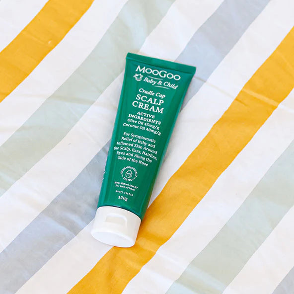 MooGoo Baby Scalp Cream tube on white background showing natural and gentle ingredient list