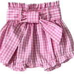 Pink gingham check baby bloomers with a bow on a gray background