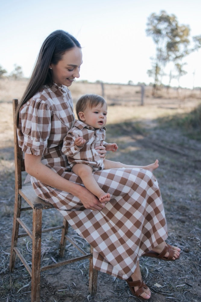 Mum and baby boy in matching brown gingham