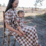 Mum and baby boy in matching brown gingham