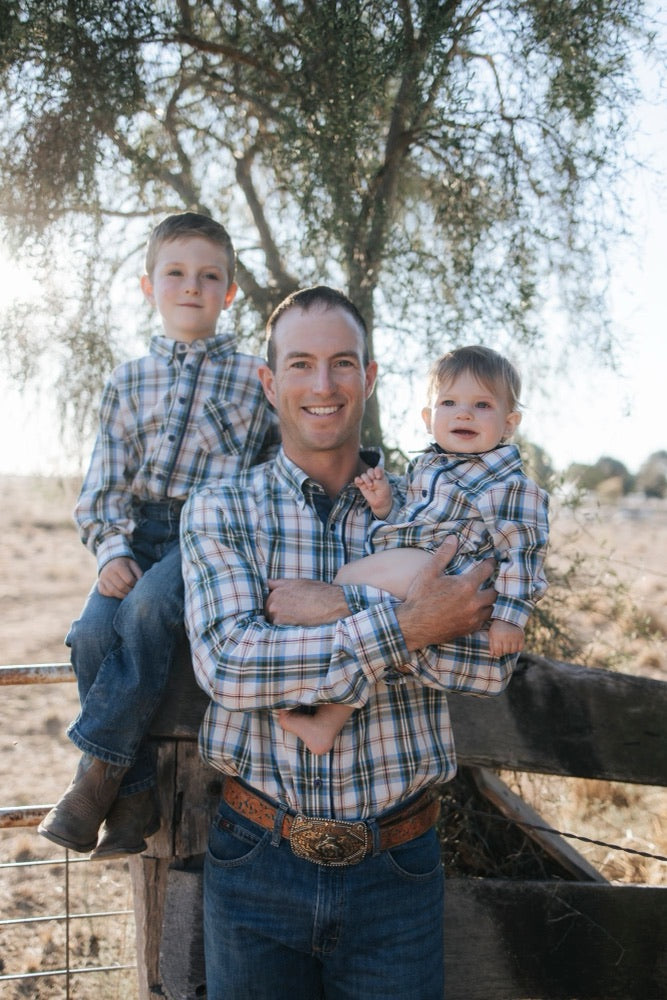 Dad and two boys in matching blue plaid shirts