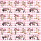 Cowgirl Life fitted cot sheet on cot showing cowgirl print fitted to standard cot mattress