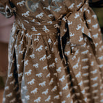 Miley horse print chocolate dress worn showing elegant chocolate horse print country dress style
