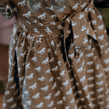 Miley horse print chocolate dress worn showing elegant chocolate horse print country dress style
