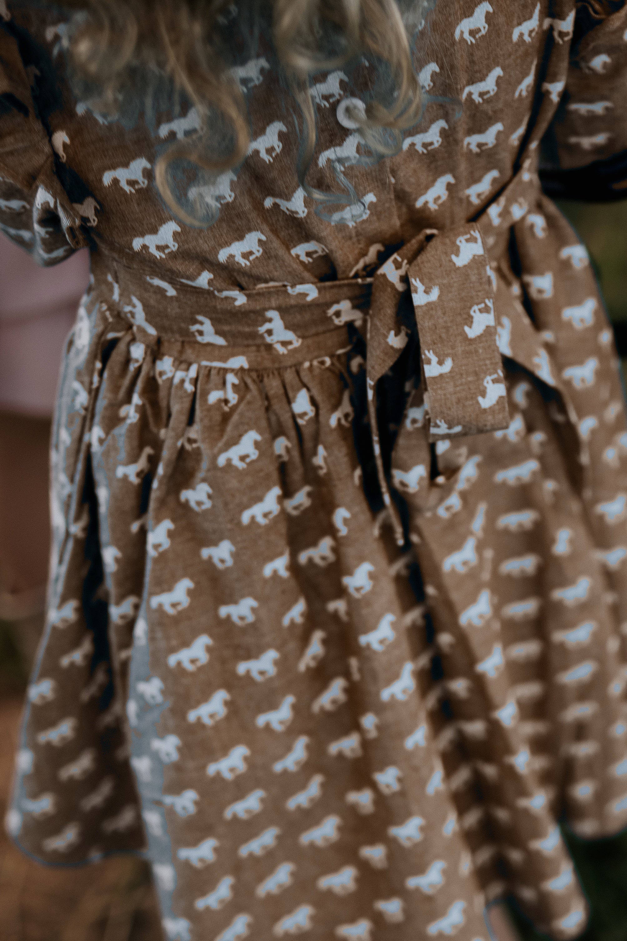 Miley horse print chocolate dress worn showing elegant chocolate horse print country dress style
