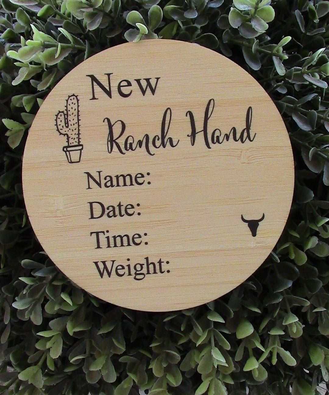 Wooden Ranch Hand Announcement plaque engraved with name, date, time, and weight fields on natural pine background