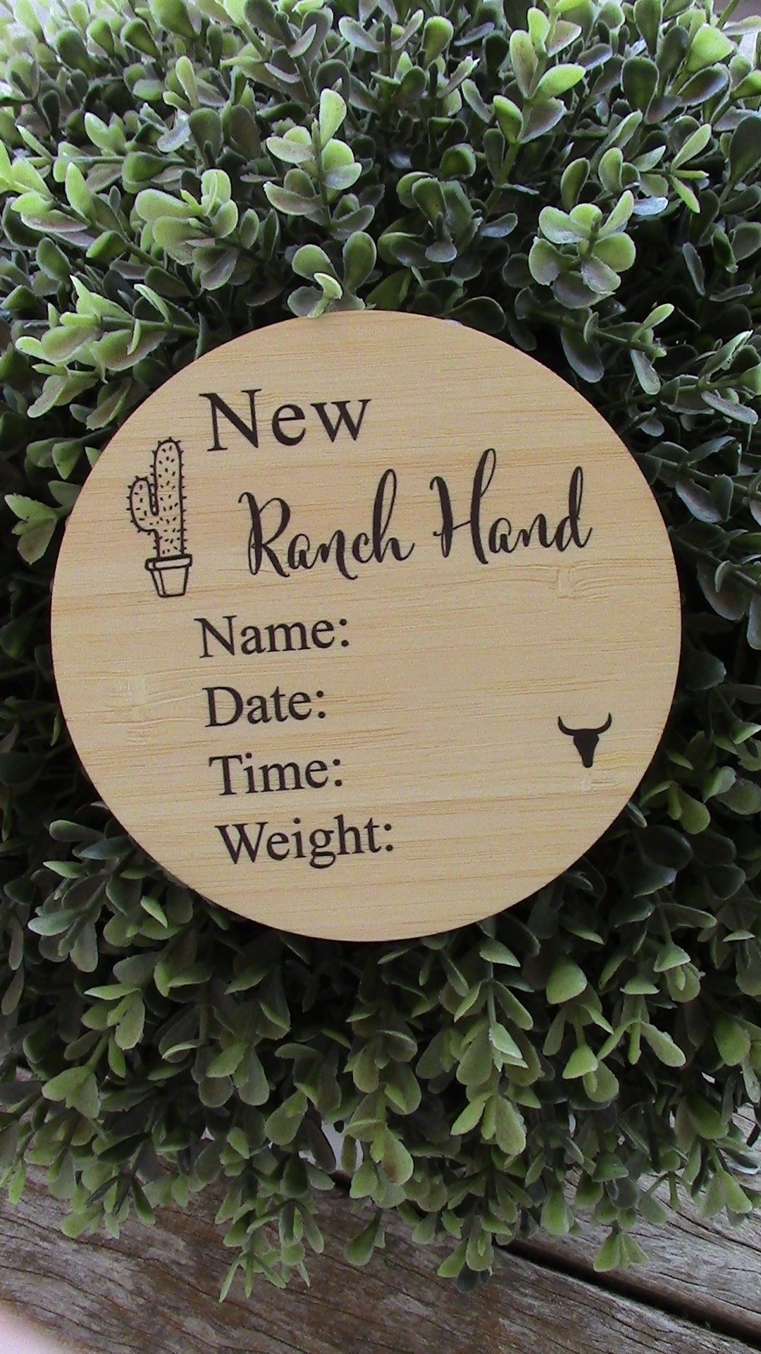 Wooden Ranch Hand Announcement plaque engraved with name, date, time, and weight fields on natural pine background