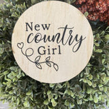 Round engraved country girl wooden plaque on natural pine with decorative leaf design
