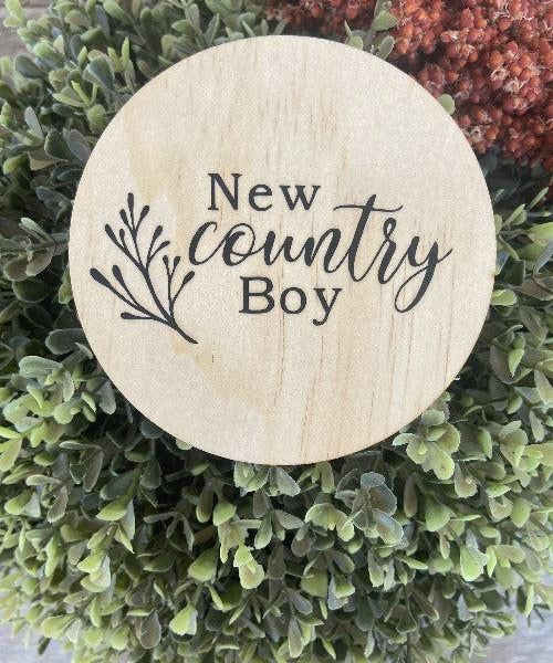 Country boy wooden plaque engraved on natural pine with "New country Boy" text and decorative branch design.